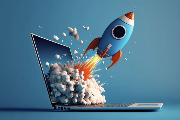 A 3-d rocket blasting out of a laptop screen