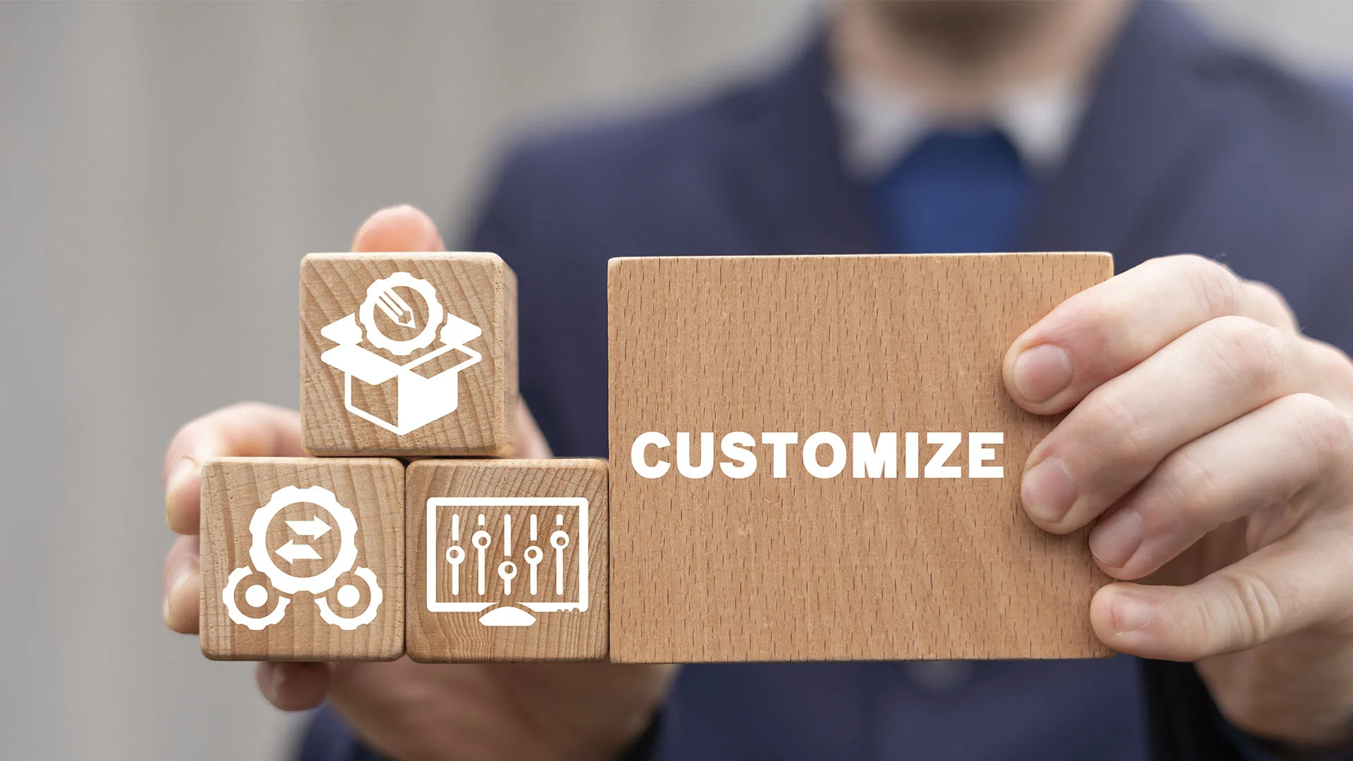 Wooden block with the word Customize next to smaller blocks with icons