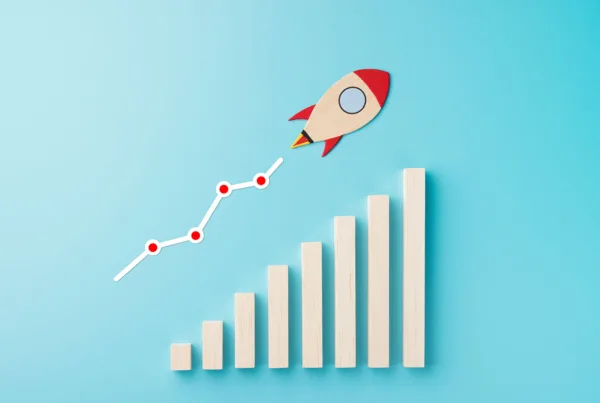a wooden rocket piece shown zooming upward over a graph