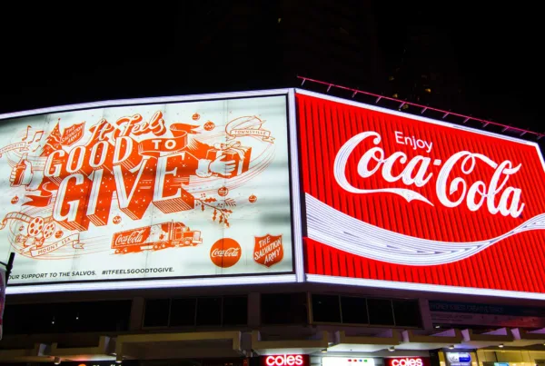 A digital billboard with Coca-Cola ads
